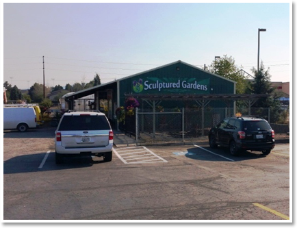 vehicles parked outside the Sculptured Garden's store.